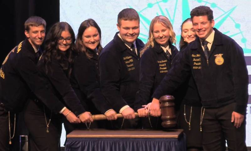 The new Indiana FFA state officers are presented at the 2024 Indiana FFA State Convention at Purdue University. The team consists of Garrett Bolin (from left), sentinel; Sienna Alexander, reporter; Kyatalin Baker, treasurer; Cale Williams, southern region vice president; Stephanie Berenda, northern region vice president; Christina Caldwell, secretary; and Ethan Wolheter, president.