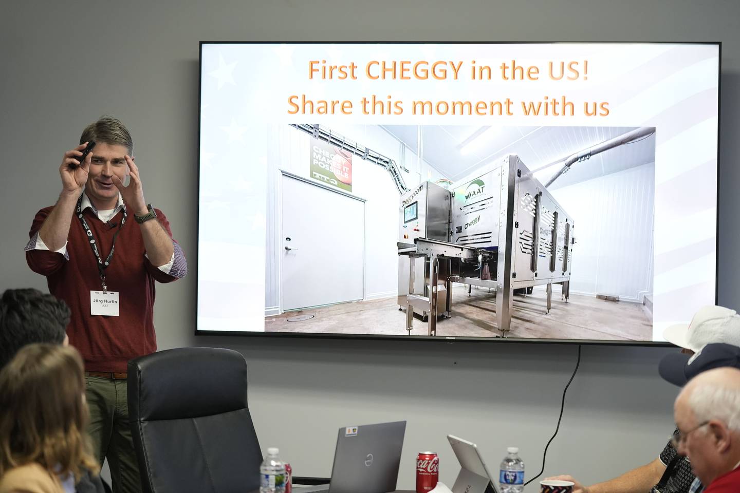 Managing director of Agri Advanced Technologies Jörg Hurlin speaks about the CHEGGY machine, an SUV-sized machine that can separate eggs by sex, before a demonstration at the Hy-Line hatchery in Wilton, Iowa.