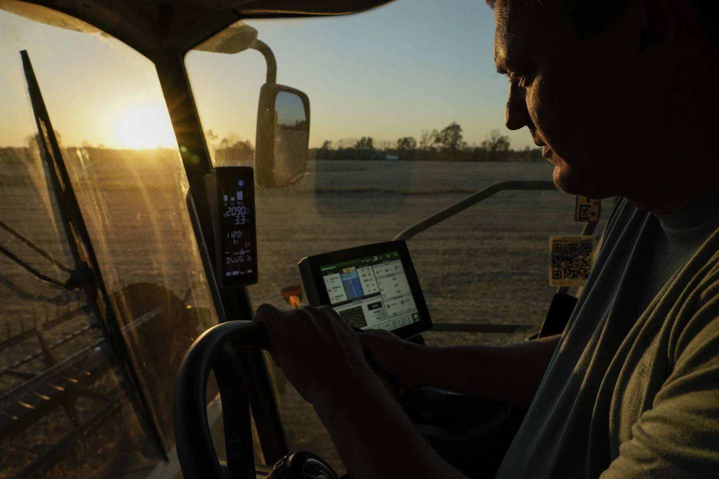 Jed Clark drives his combine while harvesting soybeans on Nov. 8, 2023, in Lynnville, Kentucky.