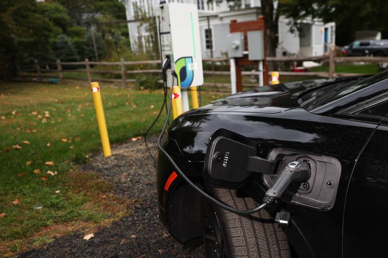 An electric vehicle is plugged into a Level 2 EV charger.