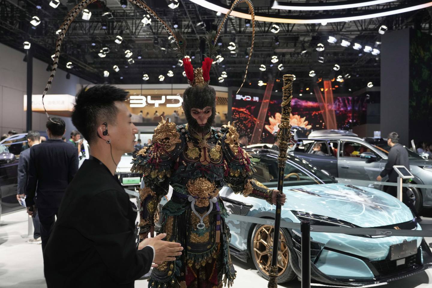 A man dressed as the character from Black Myth:Wukong promotes a special edition Han L model from BYD during the Shanghai auto show.