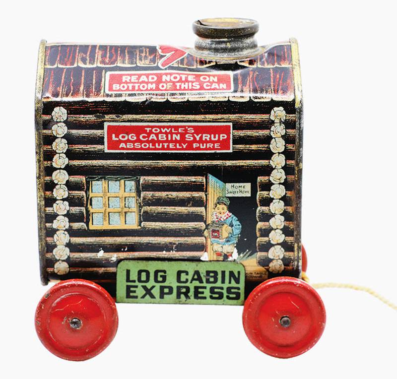 There’s finding a toy in your food packaging, and then there’s making a toy from the packaging. Towle’s Log Cabin brand provided a rolling platform to turn their iconic syrup tin into a pull toy.