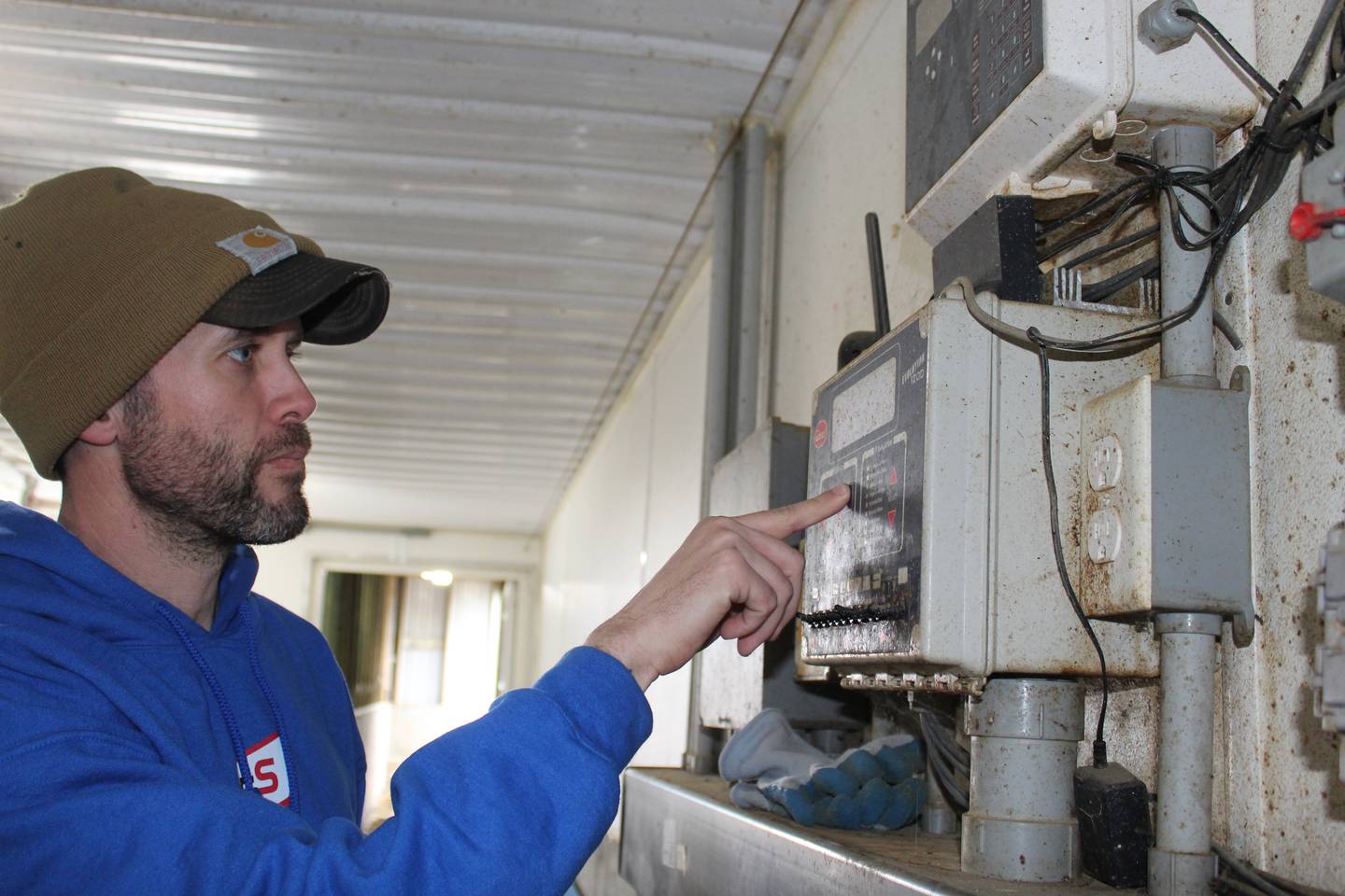 The controller is basically the brains of the swine barn, says Chad Bell. It runs the ventilation, heat and feed for the barn that has a 2,400-head capacity. The temperature is set at 80 degrees for day one and it is gradually reduced as the pigs grow.