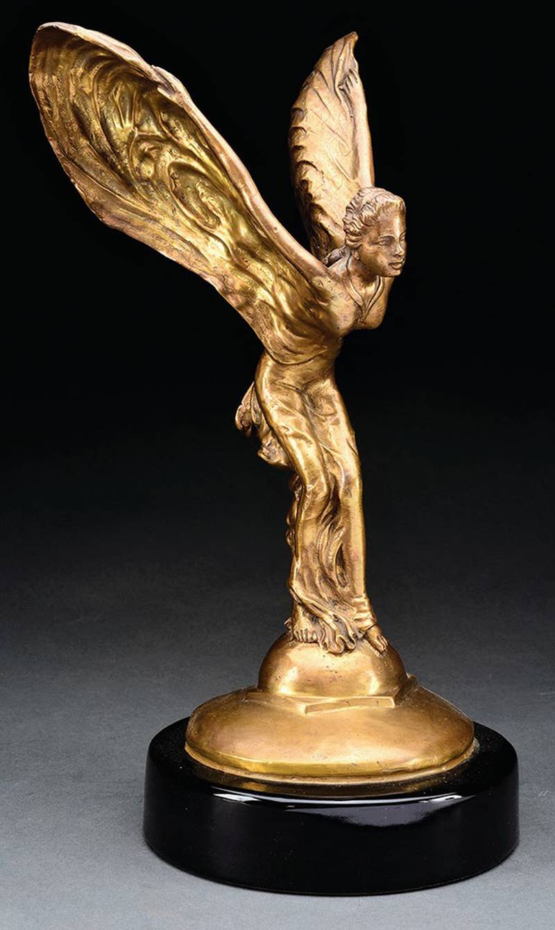 The Spirit of Ecstasy, nicknamed the Flying Lady or Silver Lady, has decorated Rolls-Royce cars since 1911. This figure is a brass reproduction.