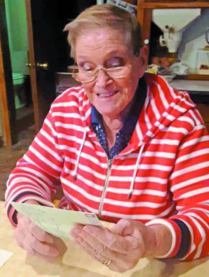 Nancy Dinelli-Prill reads a note she received from a reader of her column, “Nancy’s Notes: 'The Farmer' and I.”