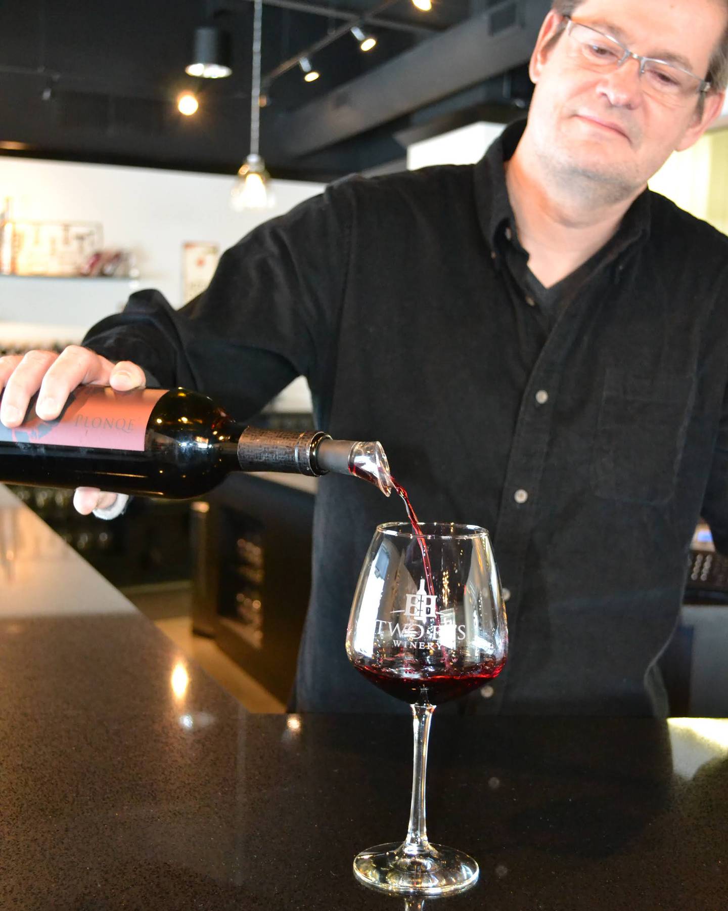 Dennis Hart pours a glass of wine at Two EE’s winery. His winemaking hobby sparked the family’s interest in opening a business. Indiana is home to more than 100 wineries. Careers in the industry include winemaking, grape growing, marketing and more.