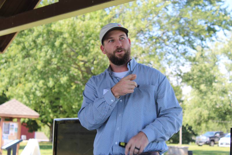 Travis Meteer discusses key components of a grazing system at All Grass Farms near Dundee, Illinois. Those attending the Regenerative Grazing School learned about a variety of topics including forage species, weed management, fencing systems and watering methods.