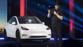Elon Musk tells investors he’ll pause on Tesla stock sales