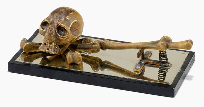 This paper clip features a bronze skull and bones, making it ready for Halloween any time of the year. Is it a modern-day memento mori or a comment on the tedium of paperwork?