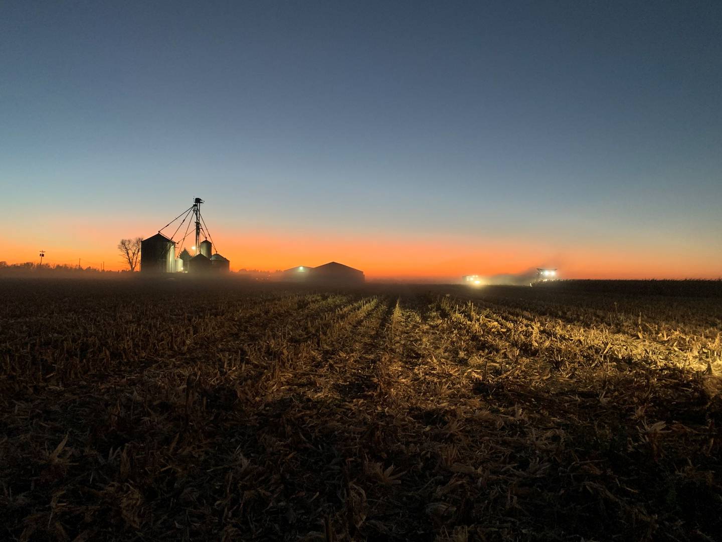 “Harvest Sunset at the Home Place” — Kristin Lykins: “With the full moon behind me, I quickly hopped out of the tractor while catching the combine with the grain cart to snag some pictures of this gorgeous sunset over our home place, the main base for our farm. My father-in-law is in the combine and my teenage daughter is in the other tractor and grain cart. My husband was doing the trucking, while my dad, who built the home place, was spending time with my mom, who was in the nursing home suffering from dementia and Alzheimer’s disease.”