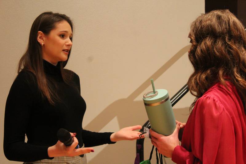 Elizabeth Lynch (left) speaks with one of the 550 students who attended the Women Changing the Face of Agriculture event following her presentation about how she choose a career in agriculture. The former Miss West Virginia is currently working to complete her doctorate degree and has discovered that she enjoys research and working with chickens.