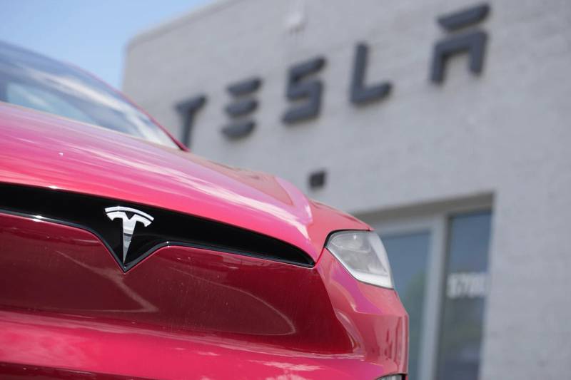 An unsold 2023 Model X sports-utility vehicle sits outside a Tesla dealership in Littleton, Colorado.