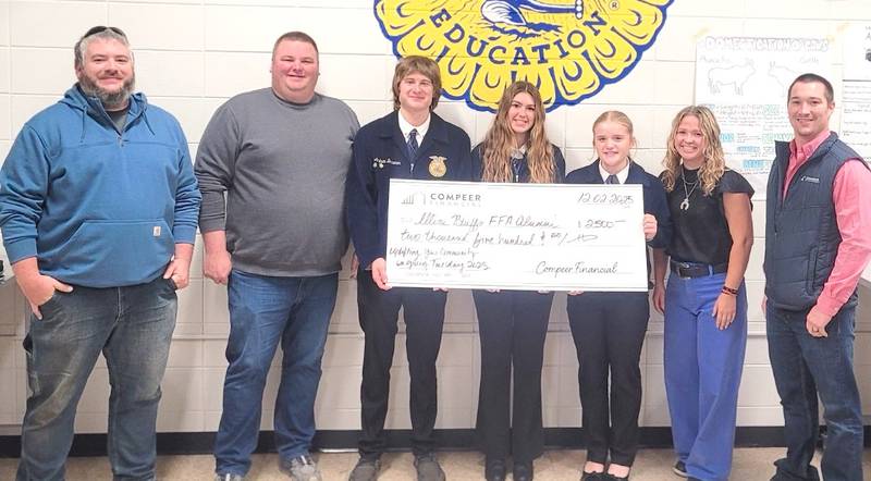 Justin Towery (far left) nominated the Illini Bluffs FFA Chapter to receive a $2,500 gift on Giving Tuesday from Compeer Financial. Also pictured are Scott Pedigo (from left), crop insurance agent; Andrew Brawner, Illini Bluffs FFA president; Josie Parker, Illini Blutfs FFA member; Maggie Allen, Illini Bluffs FFA member; Mackenzie Harmon, Illini Bluffs agriculture Teacher and FFA adviser; and Jacob Postin, financial officer at Compeer Financial. The chapter will use the funds to enable members to attend more events and conferences.