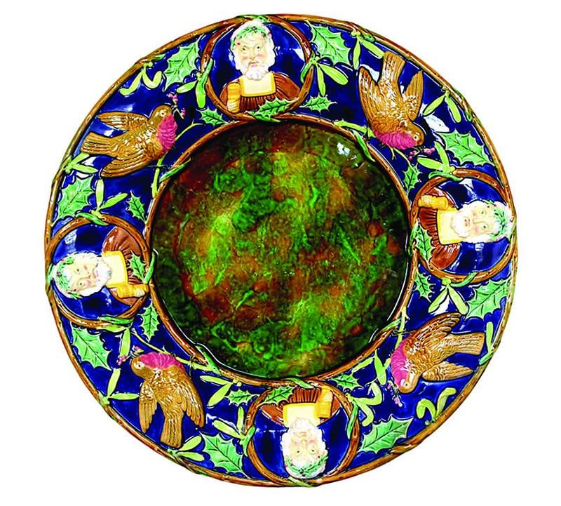 Victorian English majolica maker George Jones decorated this platter with English Christmas symbols that may be unfamiliar to Americans, but still have the spirit of the holiday.