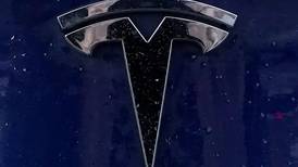After 4 U.S. price cuts, Tesla raises cost for older models