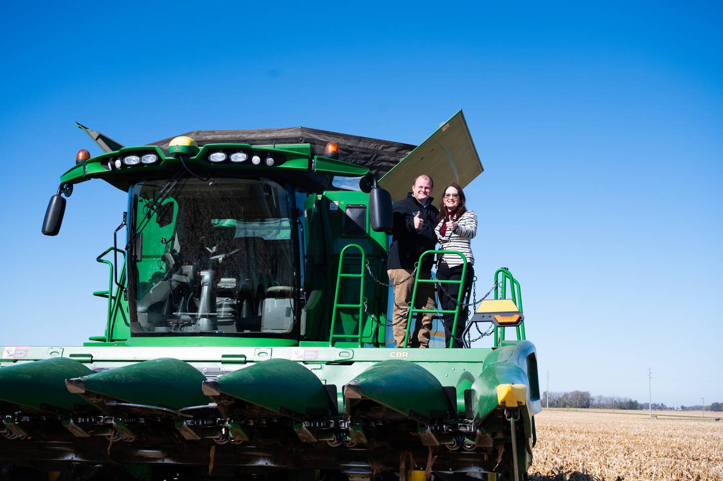 Tyler Everett and U.S. Secretary of Agriculture Brooke Rollins both give a thumbs up during her visit to his family farm in central Indiana.
