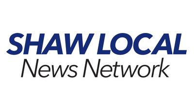 Two injured in a crash involving grain spreader and pickup truck