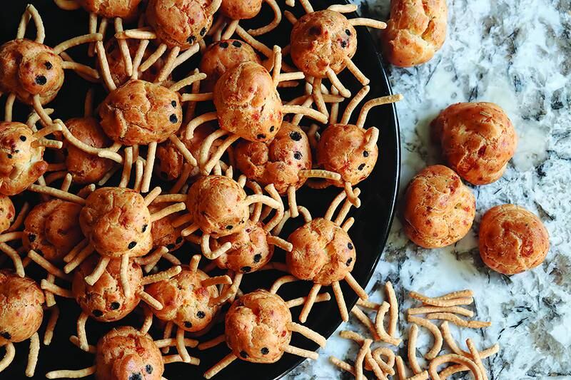 These cheesy pâte à choux spider puffs are deliciously festive for Halloween.