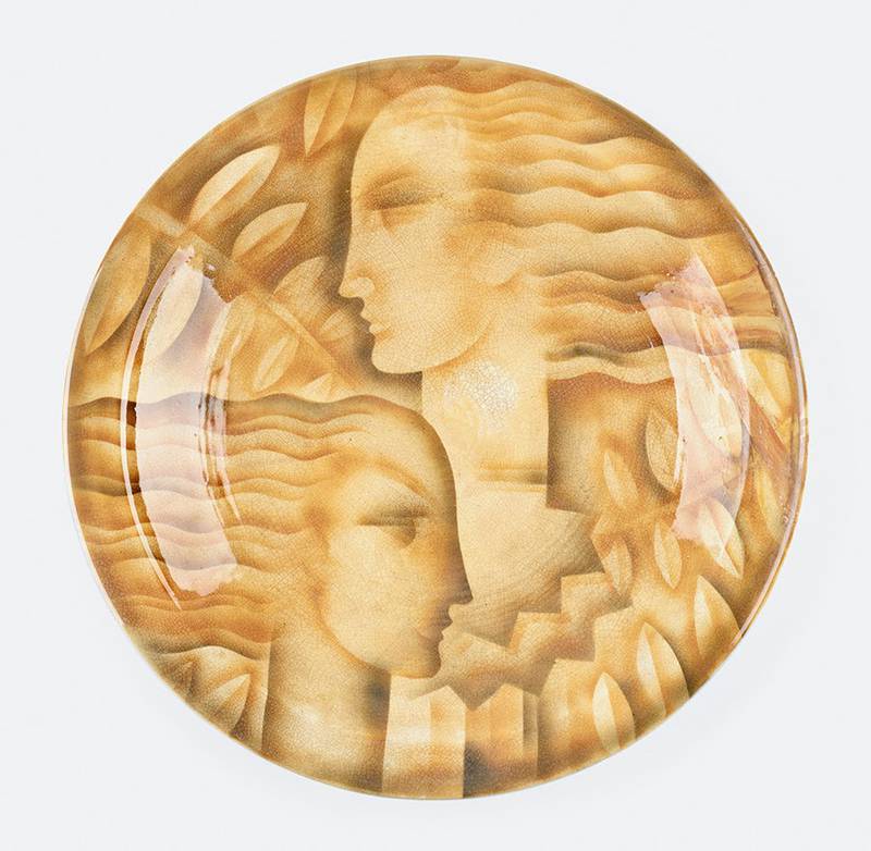 Viktor Schreckengost worked Cowan briefly and created some of their most memorable designs. This earthenware plate shows the art deco style of the early 1930s.