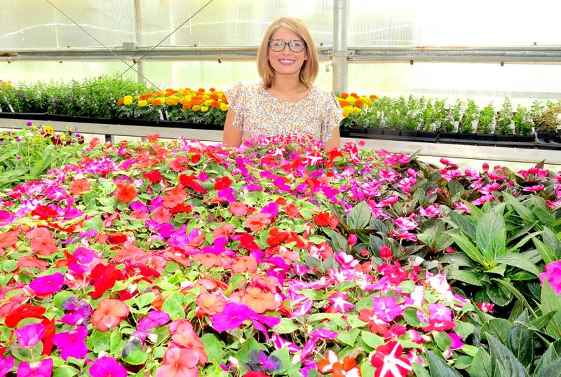 The DTHS greenhouse was filled with plants in preparation for the FFA Chapter's popular fund-raiser in early May. Sidney Krople is in her seventh year of teaching agriculture and serving as FFA advisor at the school where she was once on the other side of the desk as a student.