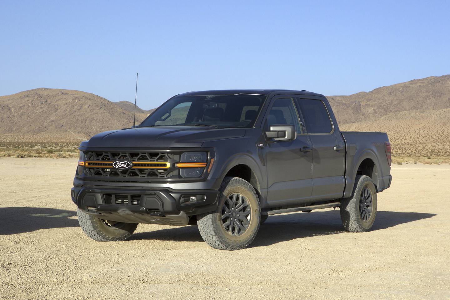 The 2025 Ford F-150 Tremor features standard four-wheel drive, a choice of two V8s, and Trail Turn Assist, a feature that brakes the inside rear wheel to tighten the turning radius.