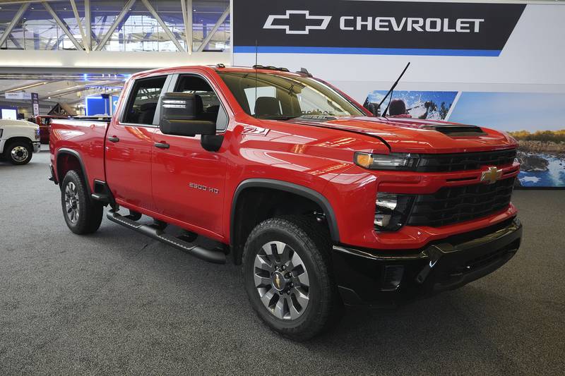 A 2024 Chevrolet Silverado 2500 HD Custom truck is shown at the Pittsburgh International Auto Show.