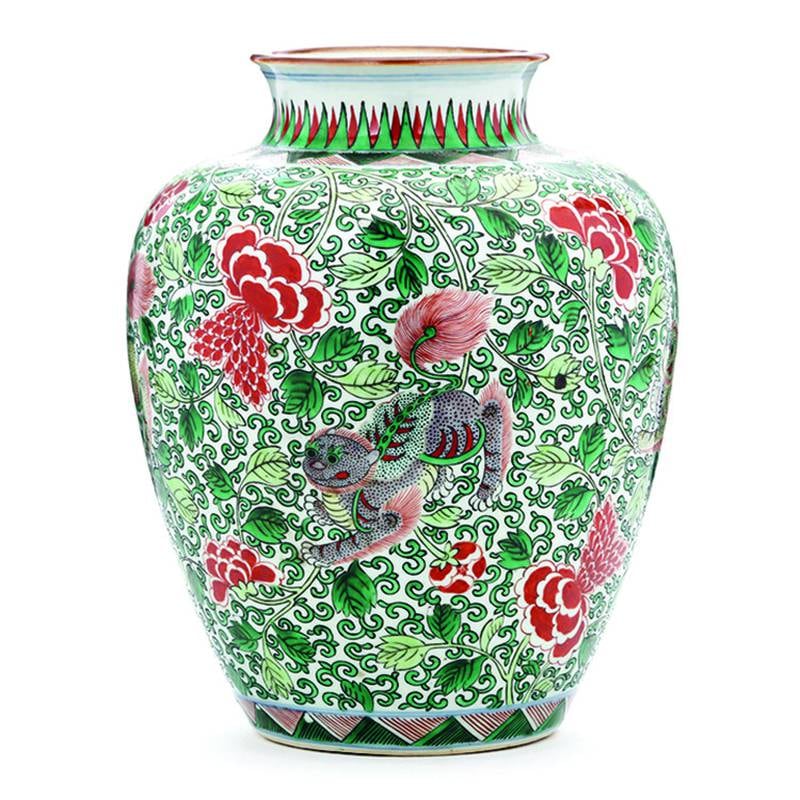 There's no doubt that a vase like this one belongs to the famille verte, or "green family" of Chinese porcelain. Spring peonies and foo dogs are popular symbols.