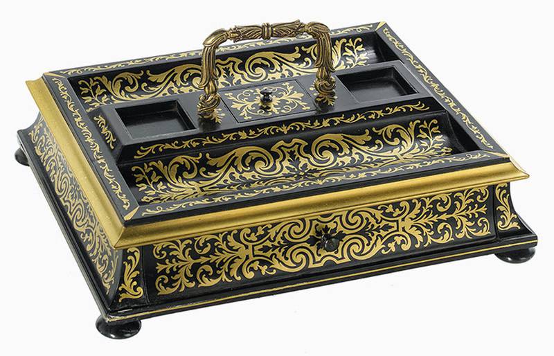 This brass inlaid inkstand was made in Victorian London. A label on its base provides insight into its history.