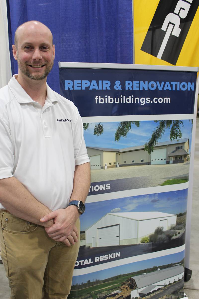 Kyle Gardiner talks about options farmers have with FBi Buildings at the booth during the Greater Peoria Farm Show. In addition to new construction, the company also offers repairs and renovations on existing structures.