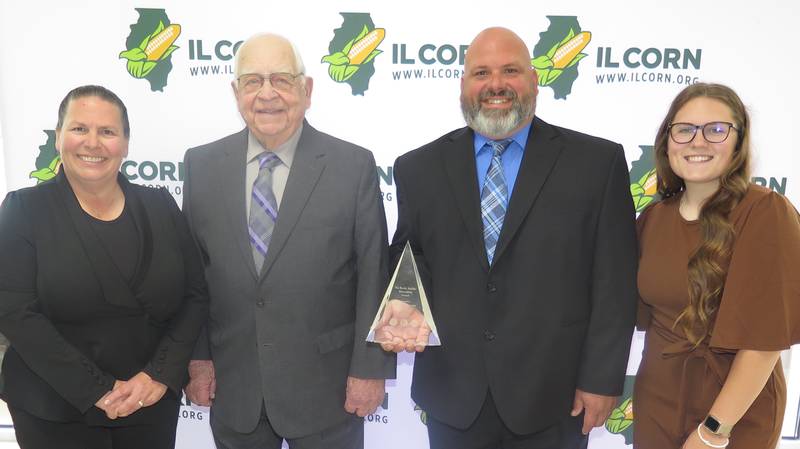 Whalen Farms received the Randy Stauffer Stewardship Award by the Illinois Corn Growers Association and Precision Conservation Management at ICGA's annual meeting Nov. 25. Family members with the award are Melissa Whalen Smith (from left), John Whalen, Jay Whalen and Eliza Smith.