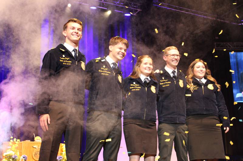 A shower of confetti and bursts of smoke greet the new Illinois FFA officers as they gather on stage for the first time as a team at the conclusion of the elections held during the 96th Illinois FFA State Convention. Members elected to lead the organization include: Trenton Payne (from left), president; Brody Will, vice president; Sidney Stiers, reporter; Owen Torrance, secretary; and Emma Dinges, treasurer.