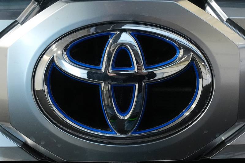 A Toyota logo is seen on a Tundra HV 4x4 at the Pittsburgh International Auto Show.