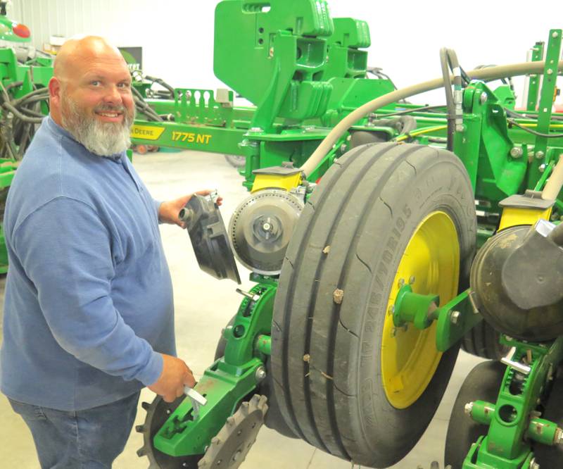 Jay Whalen checks his planter while the family was in “hold mode” on April 29. The Whalens got about half of their corn and soybeans planted before rain shutdown their progress.