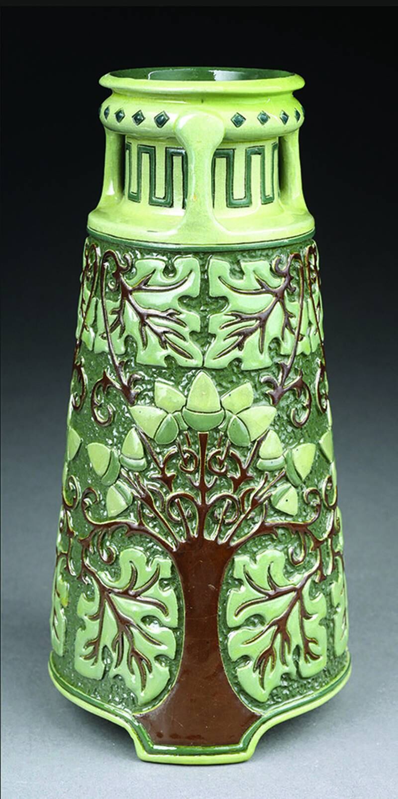 Rhead, Roseville and Della Robbia are three of the most important names in American art pottery. All of them apply to this vase.