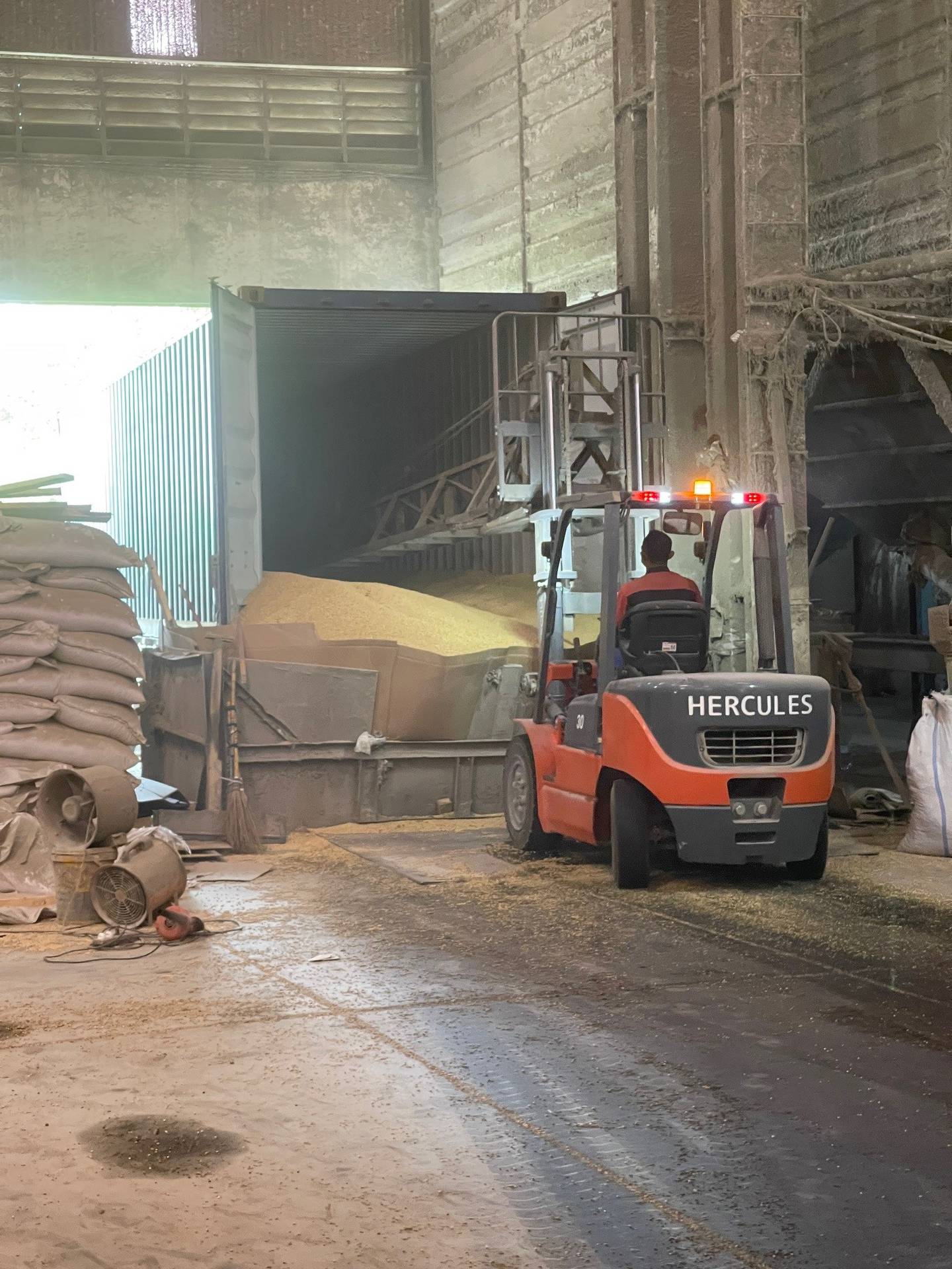 Soybeans are moved inside a warehouse in Indonesia.