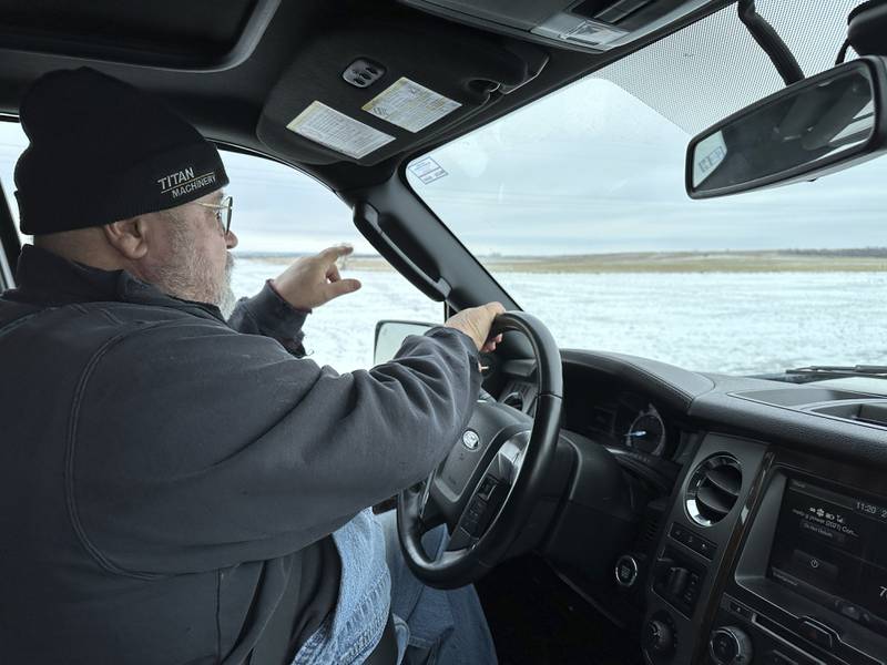 Dan McLean points to where Summit Carbon Solutions' proposed carbon dioxide pipeline would cross his land near Menoken, North Dakota. The project has drawn opposition from numerous Midwestern landowners, including McLean.