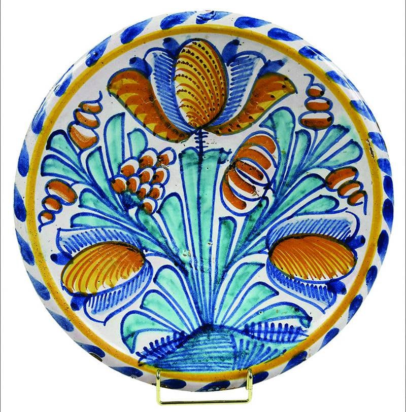 This delftware charger was made in 17th-century England. Bright, colorful flowers never go out of style, especially in spring.