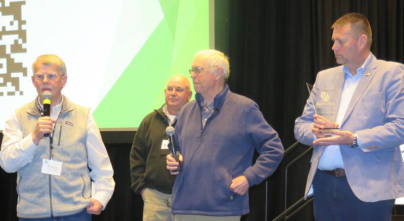 The Illinois Fertilizer and Chemical Association honored Emerson Nafziger (left) for his decades of contributions to the ag retail industry through his research and educational opportunities. Making the award presentation during IFCA’s convention were Kevin Johnson (from right), Dan Schaefer and John Pike.