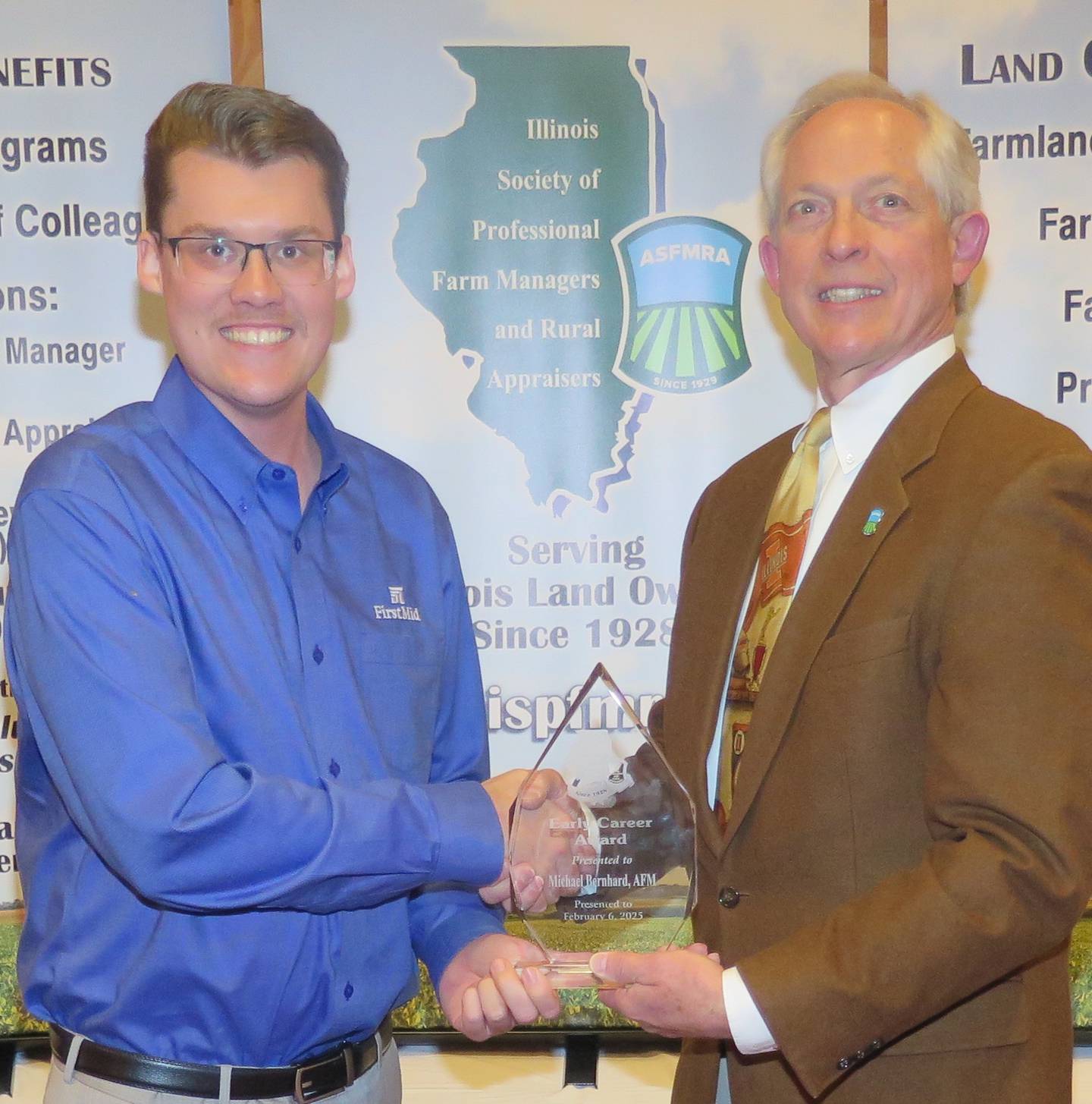 Michael Bernhard (left) received the ISPFMRA's new Outstanding Early Career Award during the organization’s annual meeting. Russ Hiatt, ISPFMRA immediate-past president, presented the award.