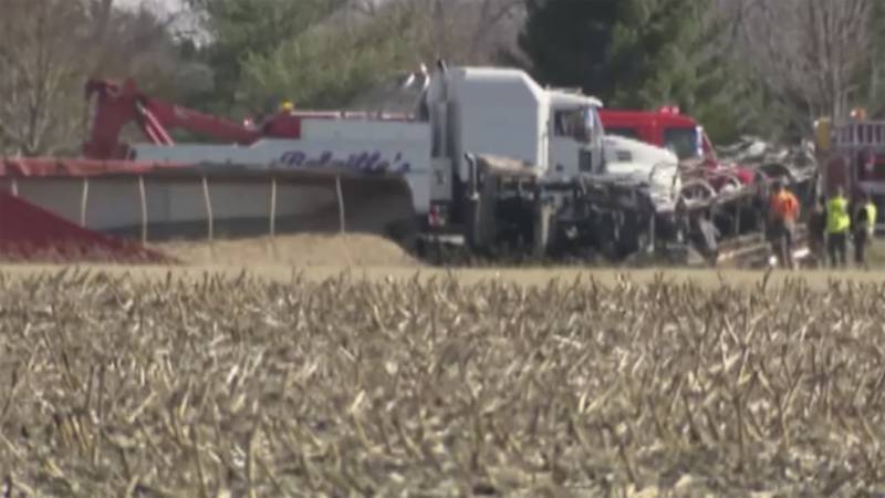 Emergency personnel work the scene of a crash on March 11 in Rushville, Illinois. A bus from Schuyler-Industry Schools was traveling eastbound when “for an unknown reason” it crossed the center line on U.S. Route 24 into westbound lanes and into the path of a semitruck carrying sand, Illinois State Police said.