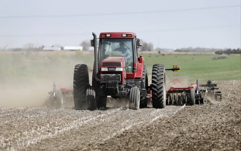 A farmer works in a field near De Soto in south-central Iowa.