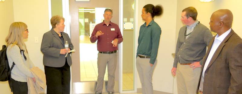 Chris Youngmark (center) leads a tour of the Peoria Next Innovation Center. Youngmark serves as the facility director and the tour marked the opening of the Illinois Soybean Association’s Soybean Innovation Center SpringBoard Challenge.