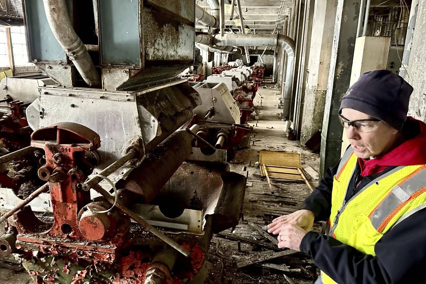 Chris Richmond, president of Moving Pillsbury Forward, explains the machine that grounds wheat into flour on the fourth floor of the AB-Mill, the former heart of the operation at the vacant Pillsbury Mills in Springfield, Illinois. The nonprofit Moving Pillsbury Forward is spearheading a $10 million plan to raze the plant and redevelop the 18-acre site.