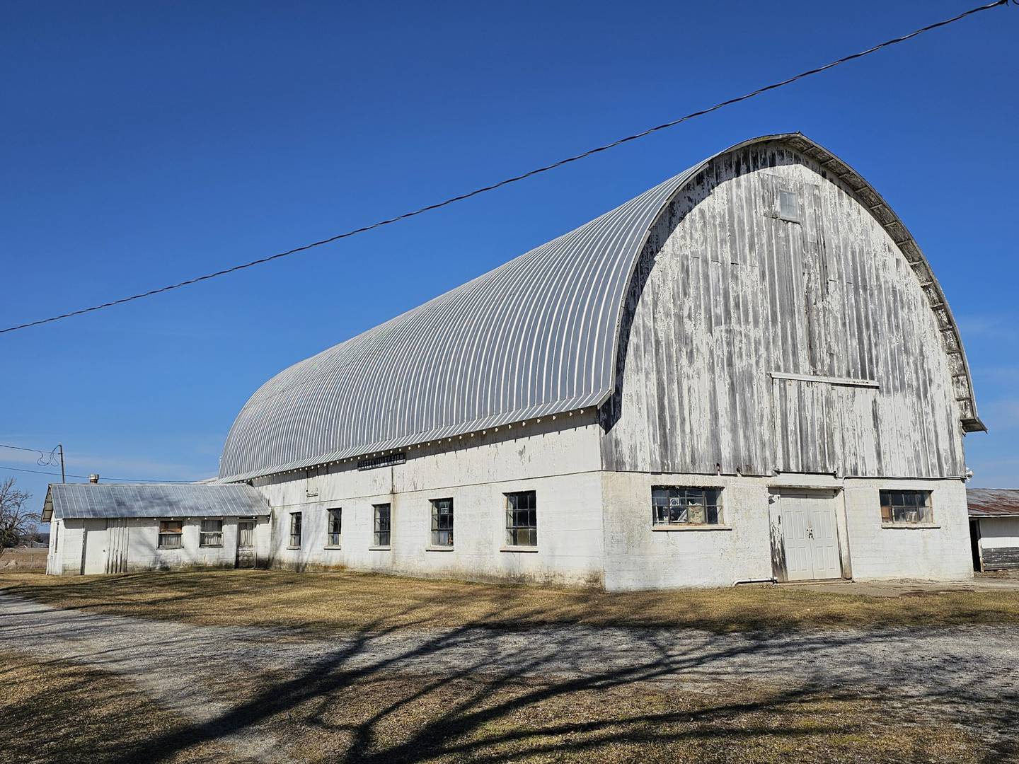 The Pretty Valley Barn is one stop on the Indiana Barn Foundation Barn Tour in LaGrange County. It was built in the 1940s to milk 40 Jersey cows. The entire lower part of the barn — including the ceiling and floor of the haymow — was constructed of concrete mixed on site and poured using wheel barrows and ramps. It included a mechanical gutter system, four freshening stalls, a milk house and granary. Today, the barn serves as storage and a workshop for the owner of the 7.5-acre farmstead.