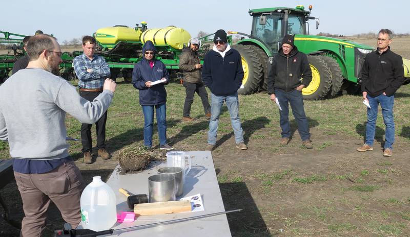Casey Kula, American Farmland Trust Midwest soil health specialist, demonstrates various tools for checking soil health. The "From Field Tile to Tap" tour began at Fulton Farms, part of the Vermilion Watershed, where utilizing no-till, strip-till and cover crops are the norm. The tour ended at the Illinois American Water facility in Pontiac, where water from the Vermilion River is treated and provides the city's drinking water.