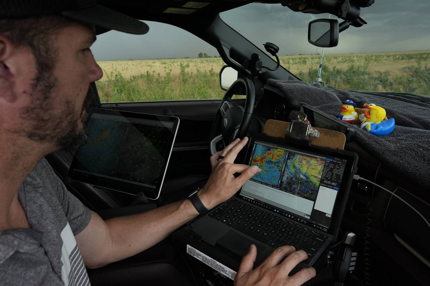 Victor Gensini, Northern Illinois University meteorology professor and a lead scientist of Project ICECHIP, checks storm data in the command vehicle during an operation south of Tipton, Oklahoma.