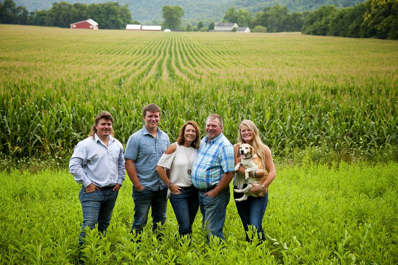 Mindy Orschell (center) stands with her family on their farm near Brookville in southeastern Indiana.