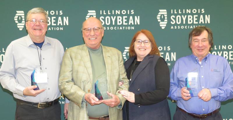 The Illinois Soybean Association presented its Achievement Awards during the annual Soybean Summit on Jan. 27 in Champaign. Among the honorees were Tom Doran (from left), Illinois AgriNews field editor, Excellence in Media Award; Doug and Nancy Winter, Mill Shoals, Farm Family of the Year Award; and Fred Below, University of Illinois crop physiology professor, Friend of Illinois Soybean Farmers Award. Other recipients were Aluizio Ribeiro, Incobrasa Industries CEO, Chairman’s Award; and state Sen. Dave Koehler, Champion of the Year Award.