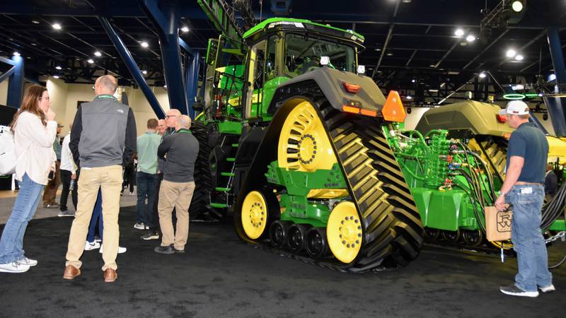 A crowd at the recent Commodity Classic convention in Houston marvels at the model year 2025 9RX four-track tractor. With an incredible 830 horsepower option, it is John Deere’s most powerful yet.