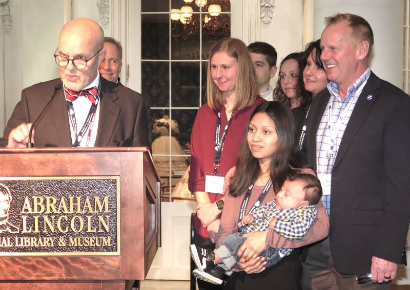 State Sen. David Koehler, D-Peoria, reads the Illinois Senate's resolution congratulating Leman Farms for being named IPPA's Family of the Year as the family looks on. The Illinois House also approved the resolution. Koehler was the Senate's primary sponsor. Senate co-sponsor Chris Balkema, R-Channahon, House primary sponsor Dennis Tipsword, R-Metamora, and House co-sponsor Sharon Chung, D-Bloomington, also participated in the General Assembly's resolution presentation at IPPA's Pork Summit.